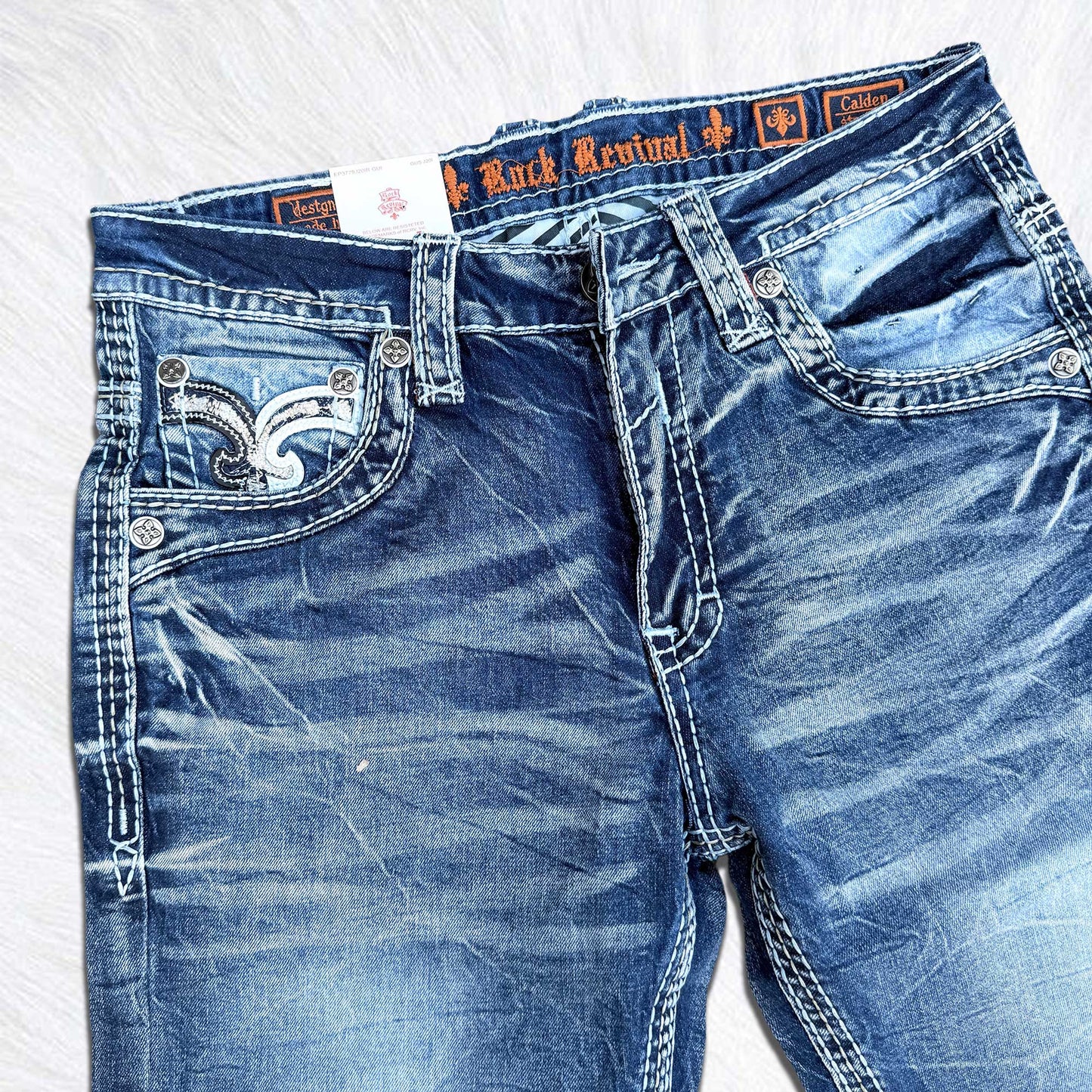 Rock Revival Calden Straight Jeans - Large Fleur de Lis Patch